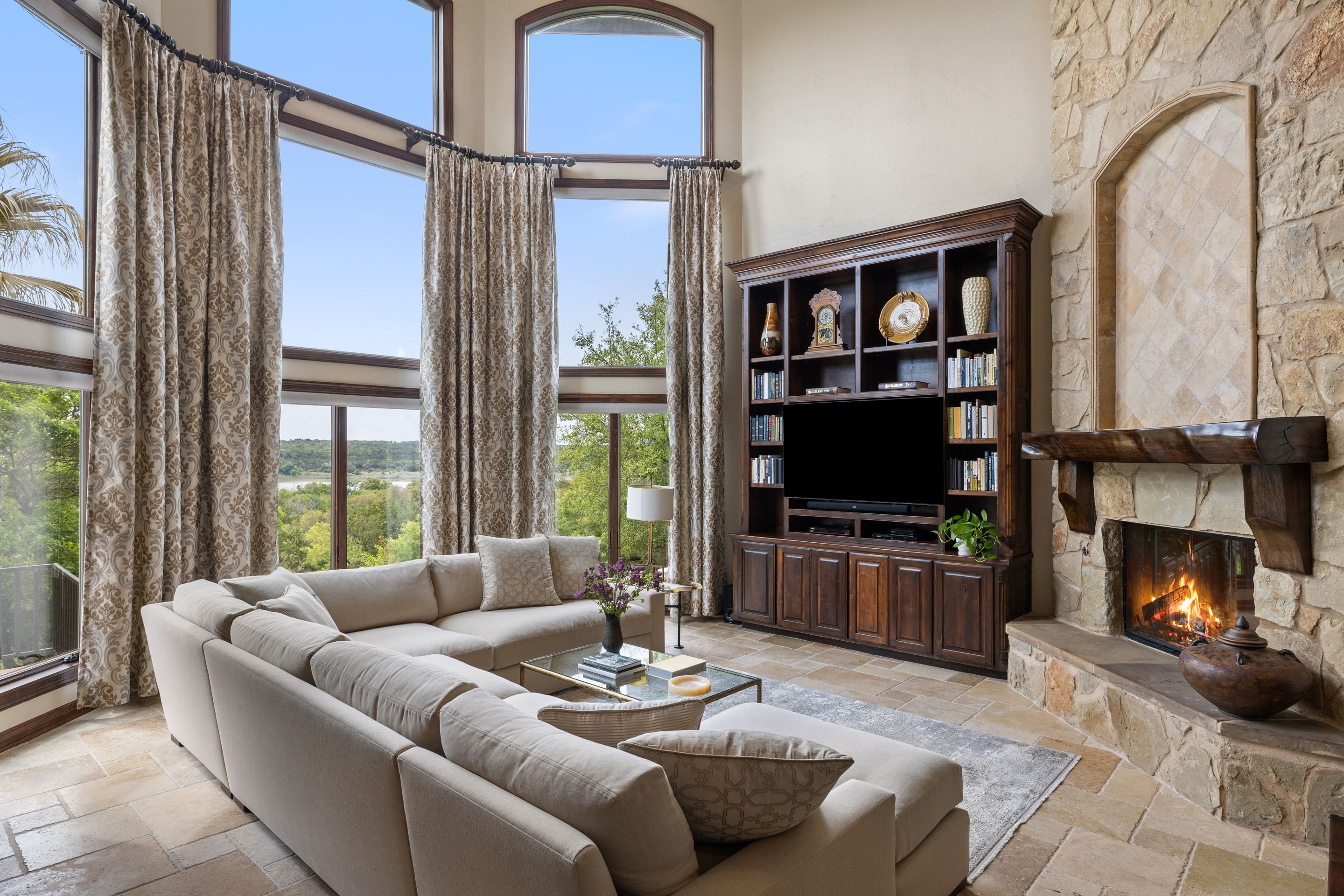 Formal living room at Lakehaven with fireplace and lake-facing windows