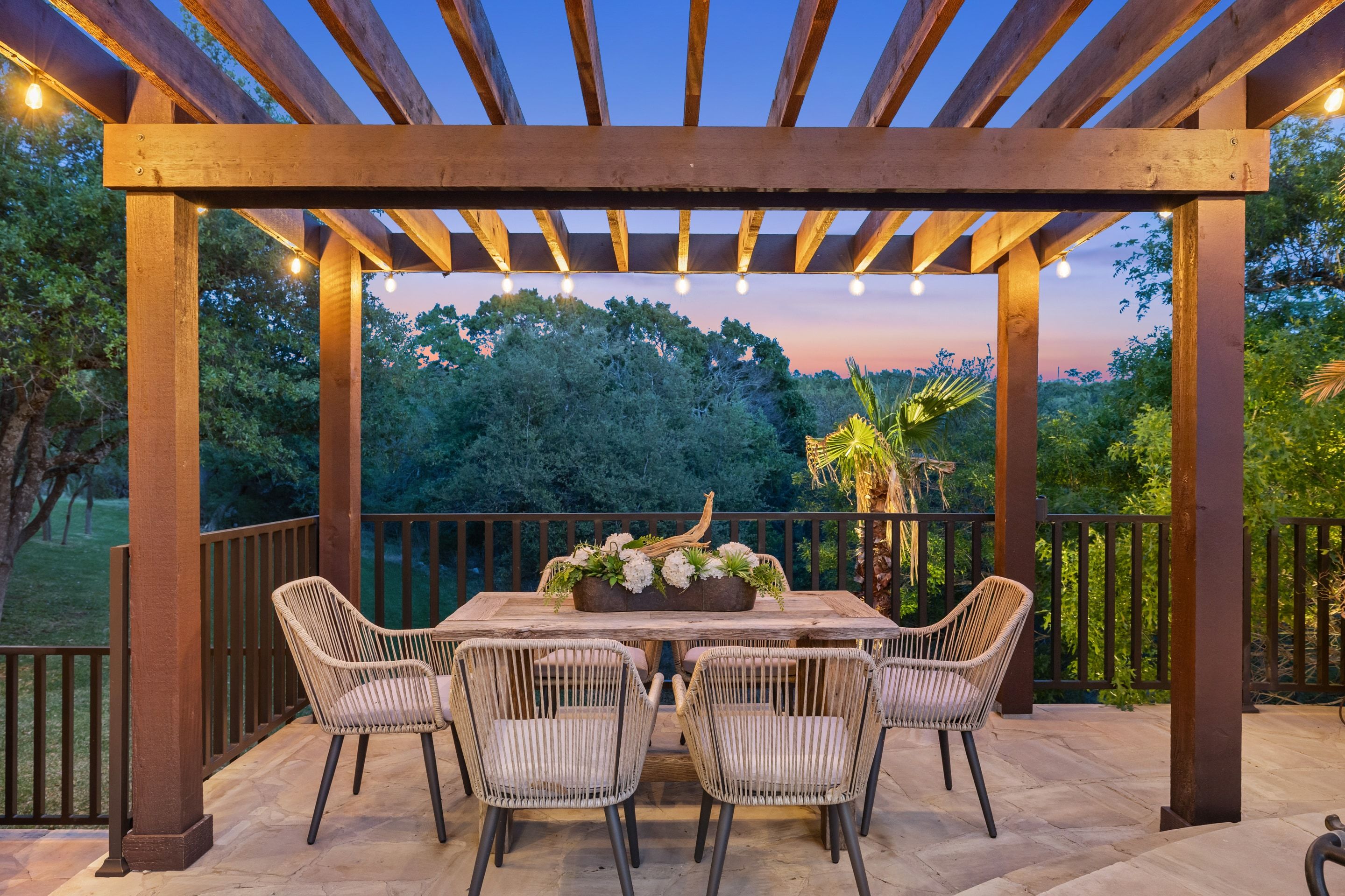 Pergola dining terrace at dusk at Lakehaven